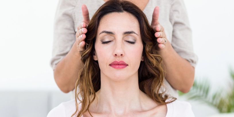 A Woman During a Reiki Treatment 