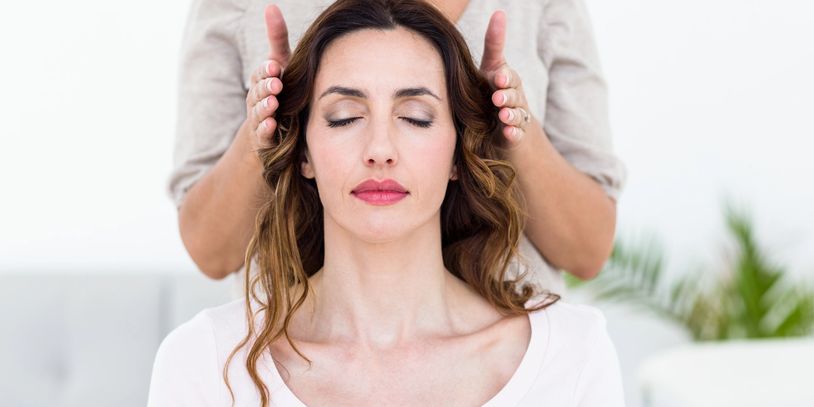 A Woman During a Reiki Treatment 