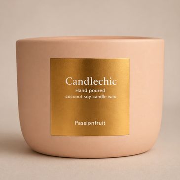 Elegant Candlechic passionfruit candle in a soft pink container with a gold label.