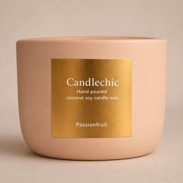 Elegant Candlechic passionfruit candle in a soft pink container with a gold label.