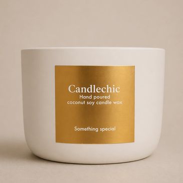 A white candle container with a golden label reading 'Candlechic'.