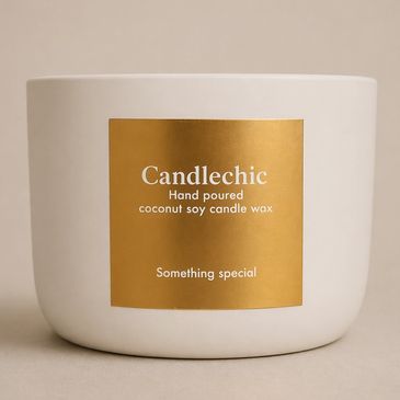 White candle container with gold label reading 'Candlechic'.