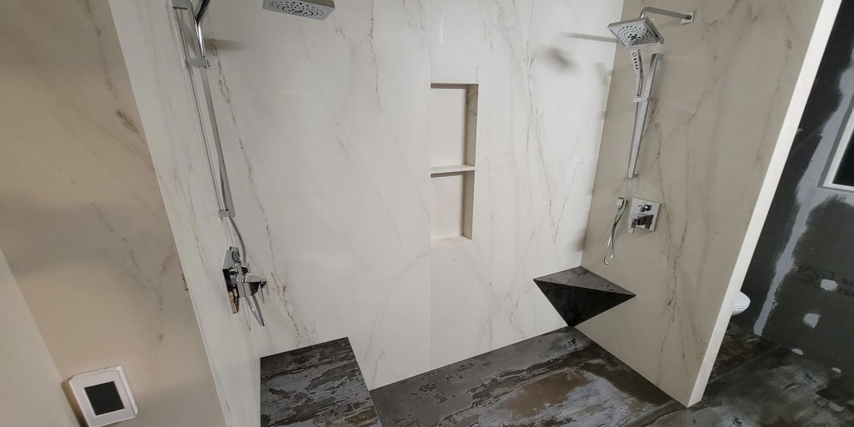 Dekton large format tile panels curbless shower