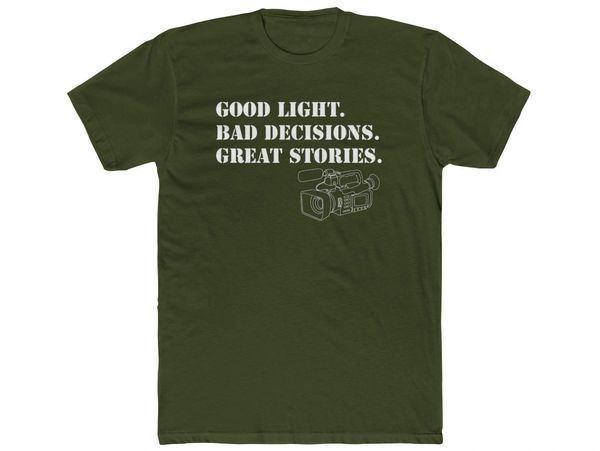 Green t-shirt with a camera and text about good light, bad decisions, and great stories.
