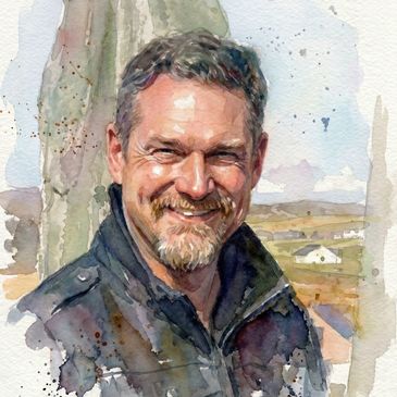 Watercolor portrait of a smiling man with short hair and a beard.