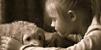 A young girl and her puppy