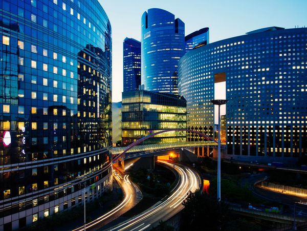 Night architecture - skyscrapers with glass facade.