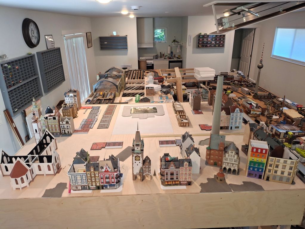 A detailed model train layout with miniature buildings.