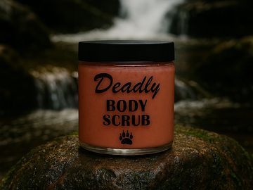 Jar of Deadly Body Scrub on a rock by a waterfall.
