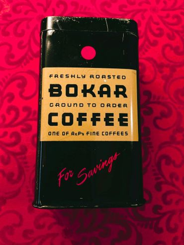 Vintage Bokar coffee tin with bold black and yellow design on red background.