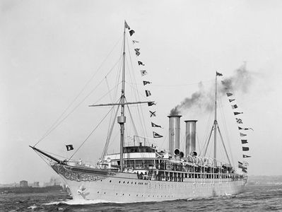 Vintage steam yacht with signal flags.