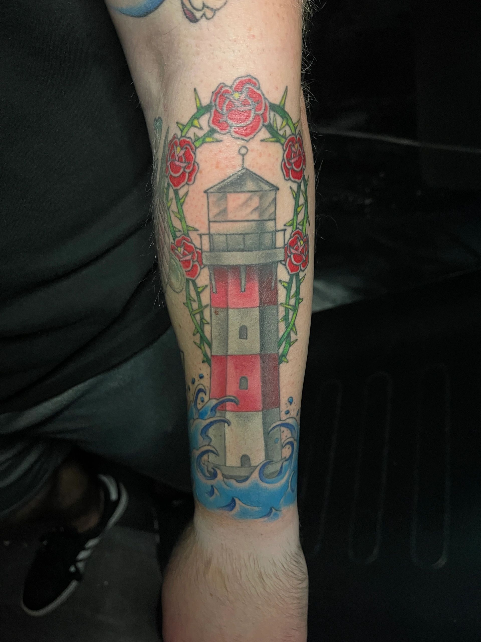 traditional lighthouse with roses