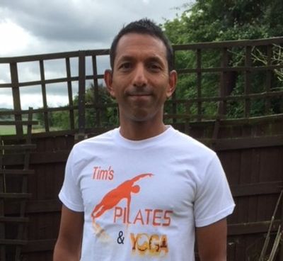 Tim wearing the Tim's Pilates and Yoga brand T-shirt