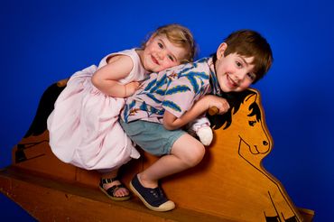 Children's portrait on blue paper background. 