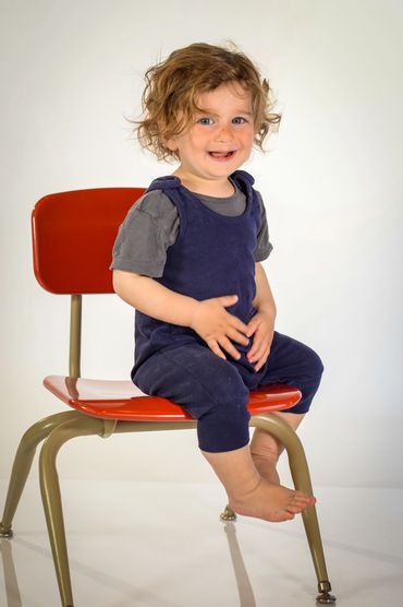 Toddler photo using white vinyl backdrop.