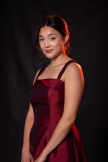 College portrait on black vinyl background.