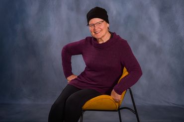 Retirement photo using classic blue fabric backdrop.