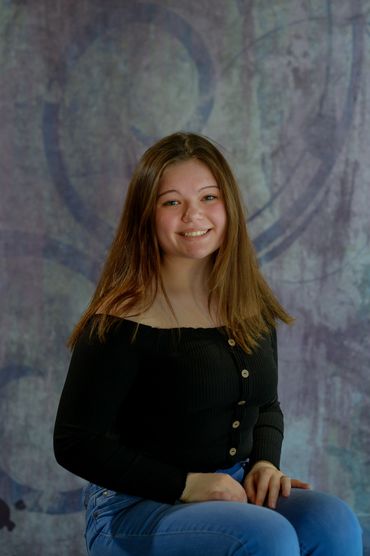 Senior high school portrait on corves pastel backdrop #1