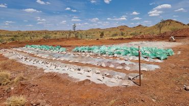 RC drill samples.  OZEX supervising RC drilling and sampling for geochemical analysis in the pilbara
