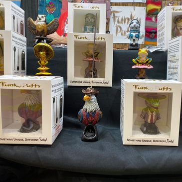 Display of colorful Funky Puffs figurines and boxes.