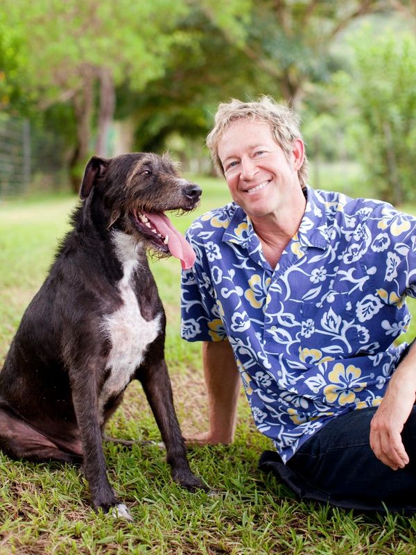 Father Bill and Wili the rescue dog
