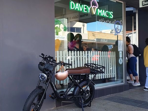 Rover E-bike parked in front of Davey Mac's shop window.