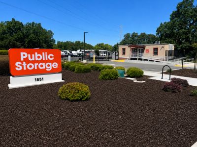 Public Storage facility entrance with landscaping and signage.