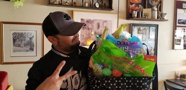 Chef Shawn Tibbitts Holding Easter Baskets for Needy Children