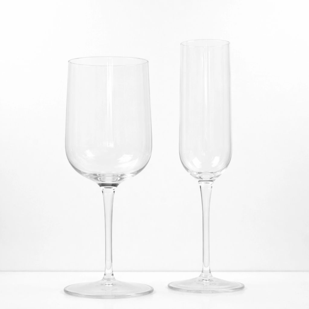 Two empty clear wine glasses, one for red and one for champagne.