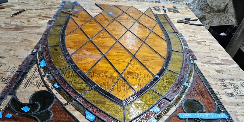 Stained glass window from 1857 with failing lead and multiple broken pieces. Master Designed.