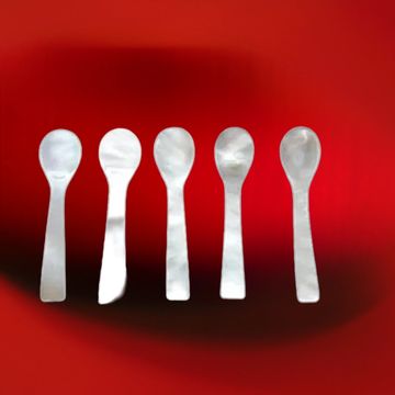 Elegant Mother of Pearl caviar spoon—crafted for the perfect tasting experience.