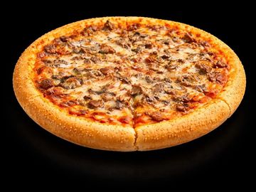 A whole mushroom pizza with a golden crust on black background.