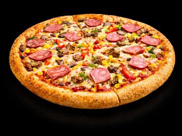 A delicious pizza with pepperoni, vegetables, and corn on a sesame crust.