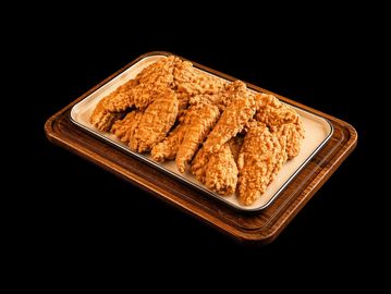 Crispy fried chicken tenders served on a tray with a wooden base.