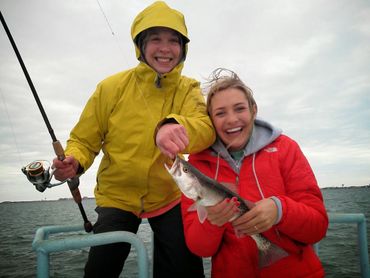 Mother daughter fishing ship speckled trout
