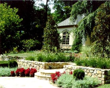 Stone stairs accented with red flowers.