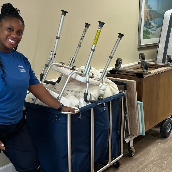 team member in front of lineup of furniture removal from senior living facility