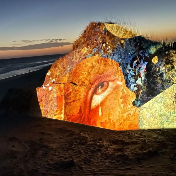 light art, projection mapping by Artist Robin Vuchnich on dunes at the Outer Banks NC