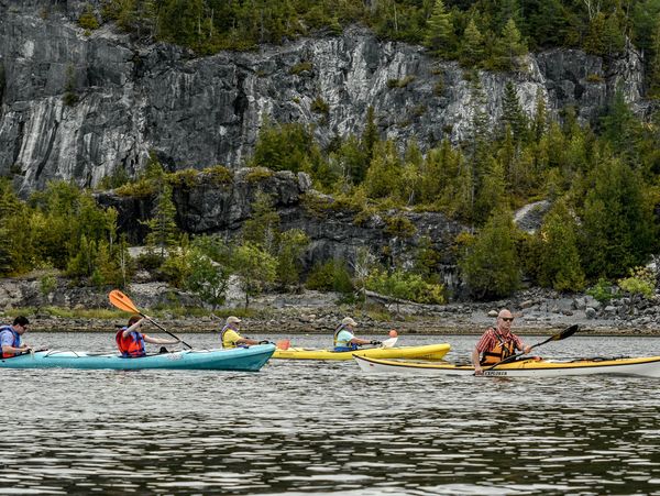 Kayaking under the cliffs at Greenhead cove. Learning about an 18th century quarry site.