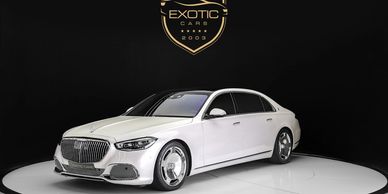 White Maybach luxury sedan available for exotic car rental, offering ultra-premium comfort and prest