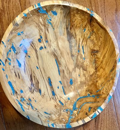This bowl embraces the spirit of Kintsugi, a Japanese art in which broken pottery is mended by filli