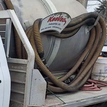 Porta John pumping truck. Portable restroom suction equipment.