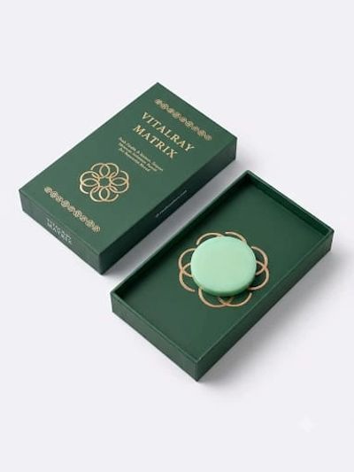 Green Vitalray Matrix box with a round item inside.