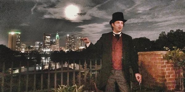 photo of person and downtown skyline at night