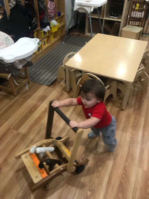 Infant practicing his walking. 
