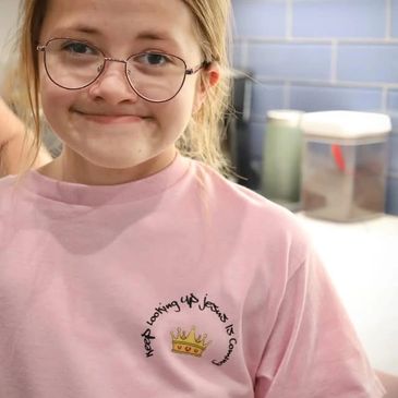 Girl in pink Christian message shirt