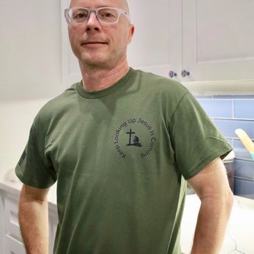 Man in green faith-based T-shirt