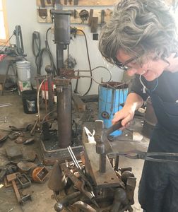 One of our students at Blackthorne  Forge having a great time learning how to forge