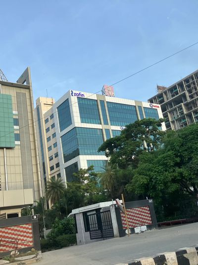 Modern office buildings with clear blue sky.
