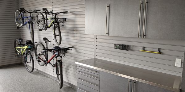 Pewter Garage Cabinets with a stainless steel countertop and slatwall